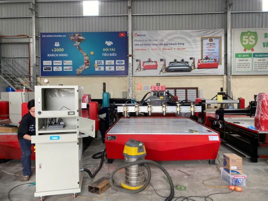 2 máy duc cnc go 6 dau